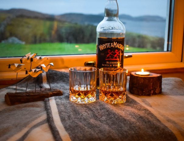 Enjoy a dram overlooking the Summer Isles when you stay at Gables Cottage